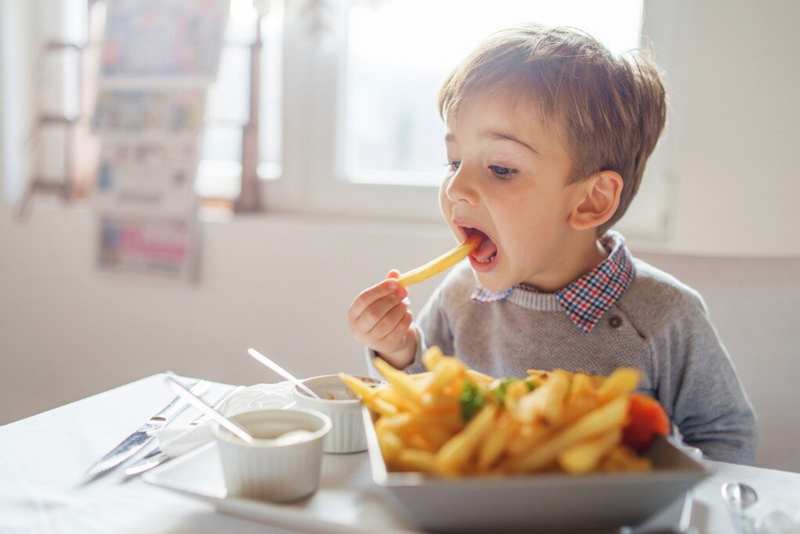 kid-eating-junk-food-stress-eating-disorder